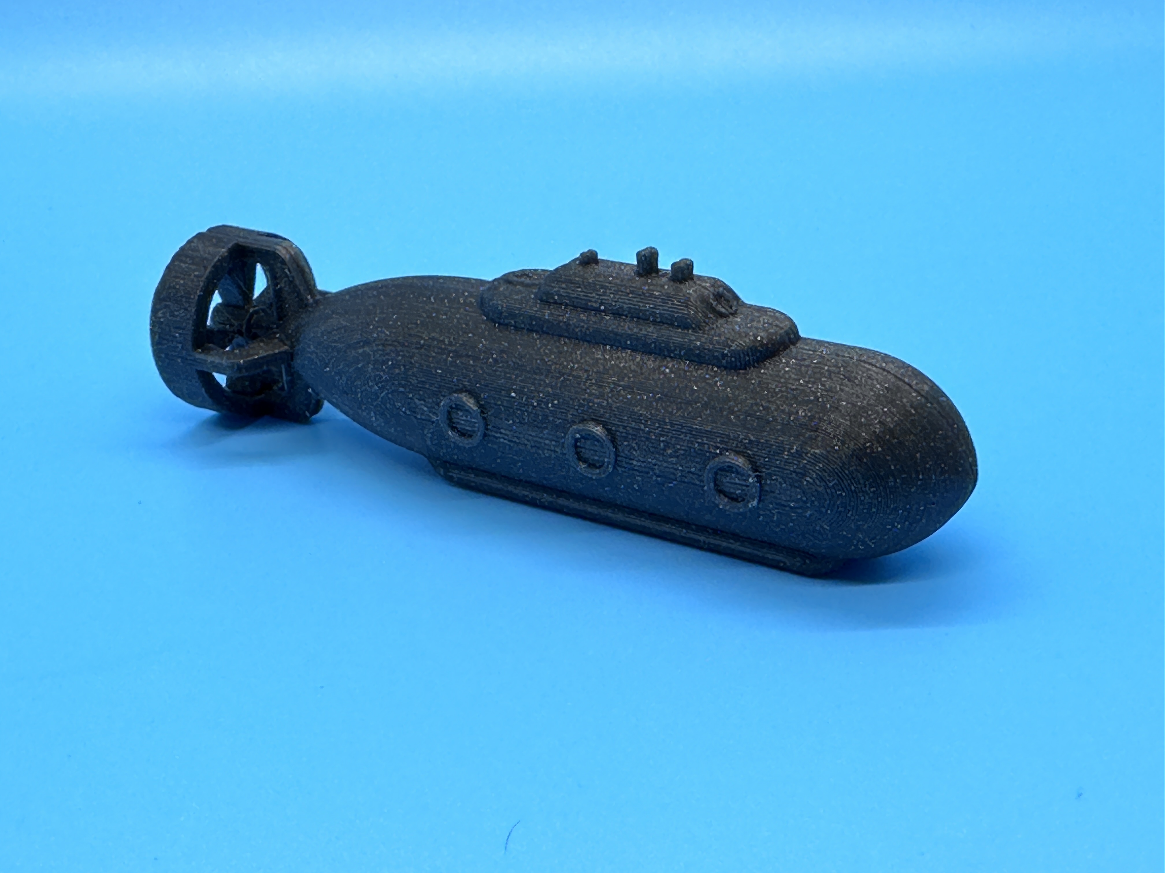 Upgraded game token that looks like a black submarine